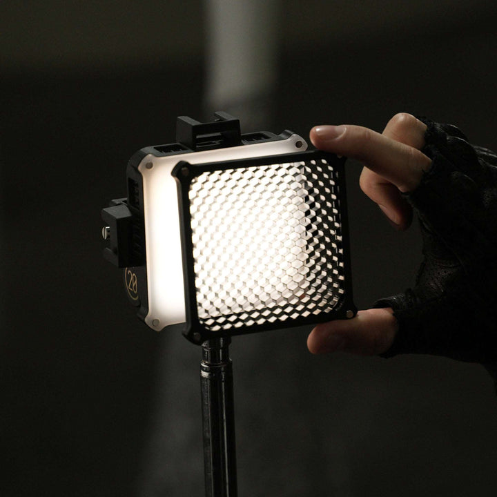 ZHIYUN Black four-leaf-shaped photography light shade, with grid honeycomb, grey zipper bag, white square panel, and photography accessory.