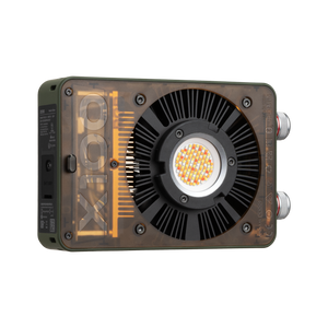 Zhiyun MOLUS X100 RGB pocket camera gimbal stabilizer light showing lens detail — compact rgb camera light design