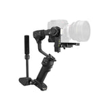 Professional filmmaker using ZHIYUN CRANE 4 3-axis gimbal stabilizer to shoot cinematic video outdoors